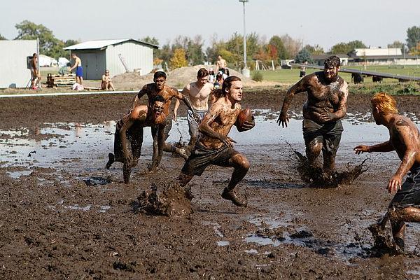 Students compete against one another during the annual OPS mud football competition. 
